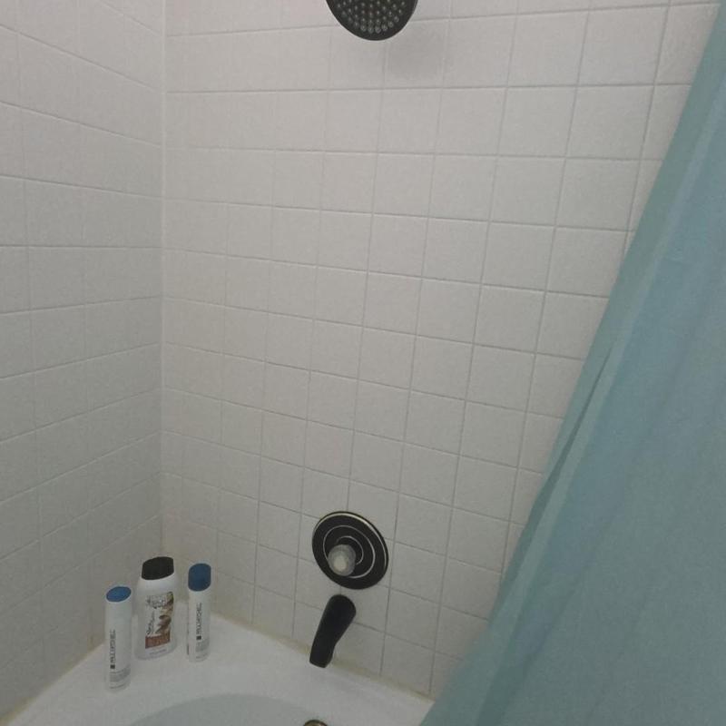 Shower valve installation with trim in tiled shower