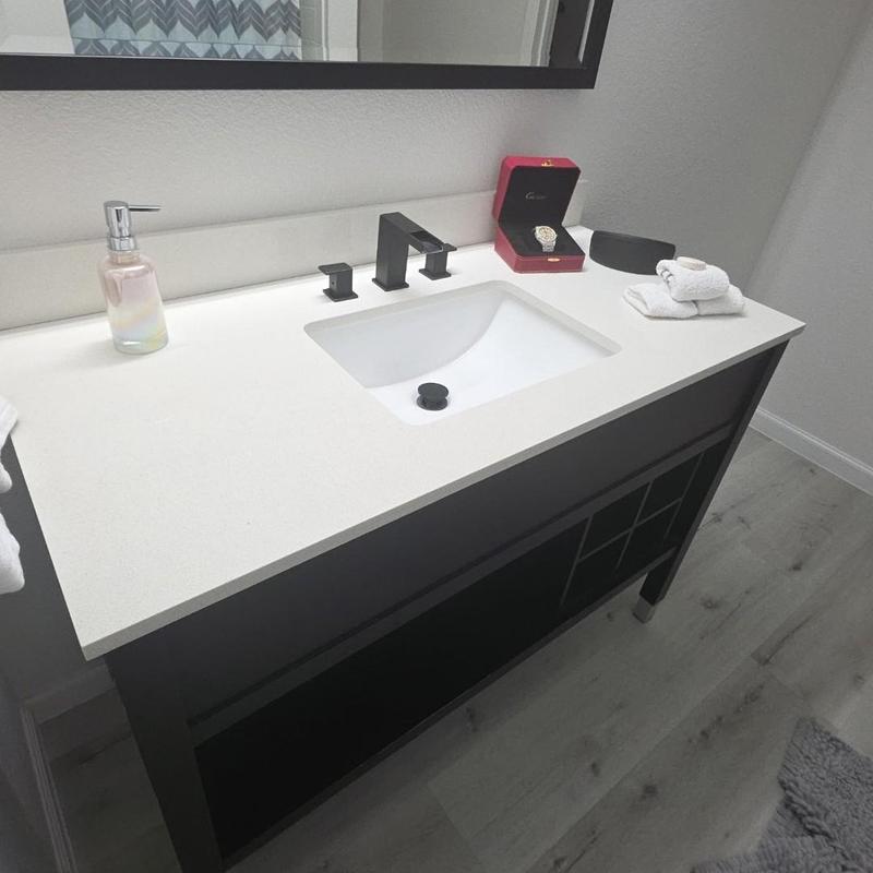 Under mount sink with black faucet and vanity installation