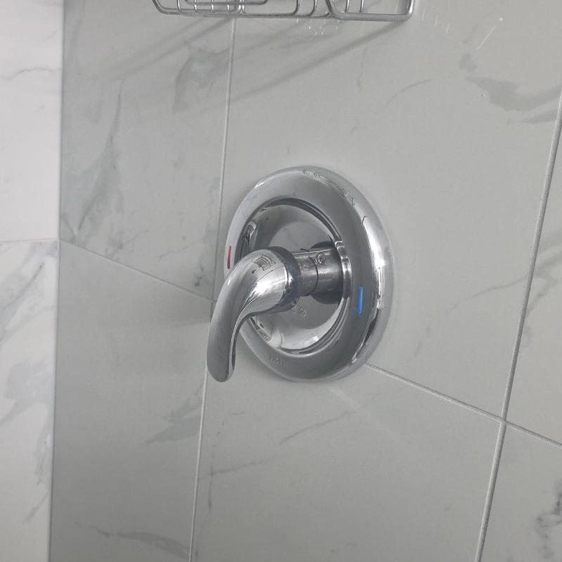 Shower valve handle on tiled wall installation