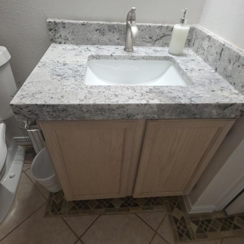 Vanity faucet and granite countertop with under mount sink