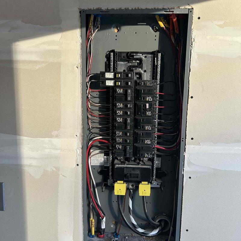 Electrical breaker panel with installed wiring and breakers