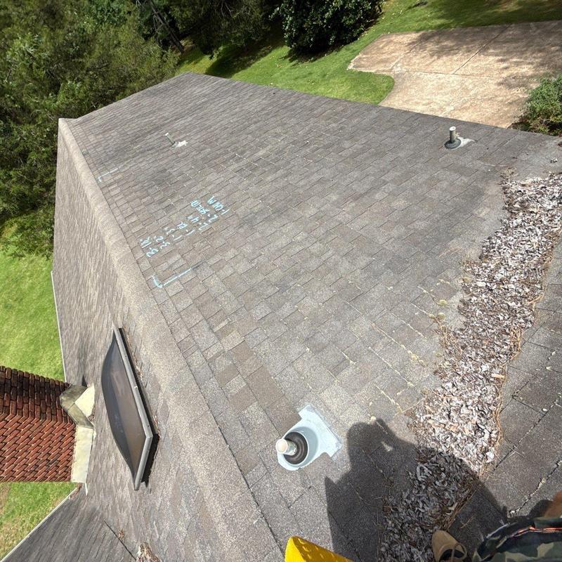 Asphalt shingle roof with hail damage and wear