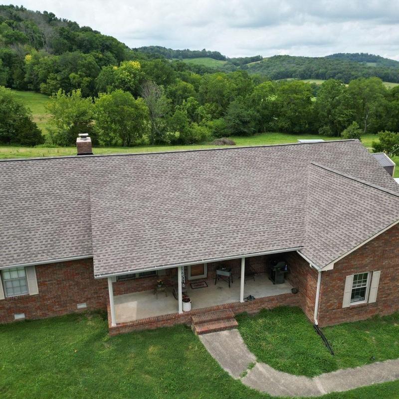 Asphalt shingle roof with hail damage and wear