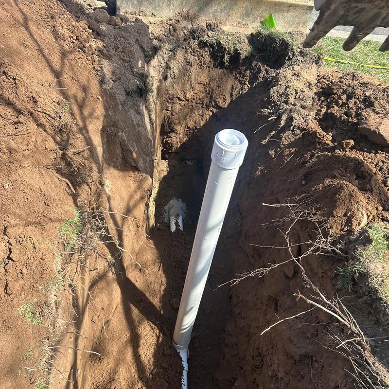 Sewer line pipe installation in open trench Sewer line pipe installation in open trench