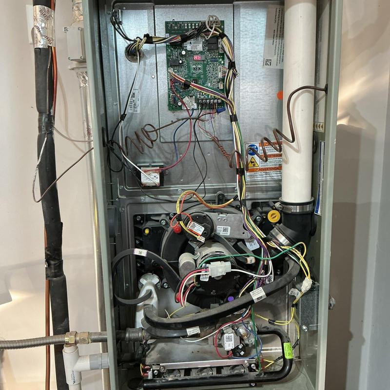 Gas furnace rollout switch with wiring inside panel