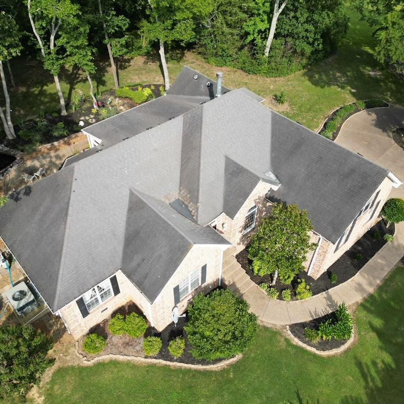 Roof shingles with hail damage and wind lifting