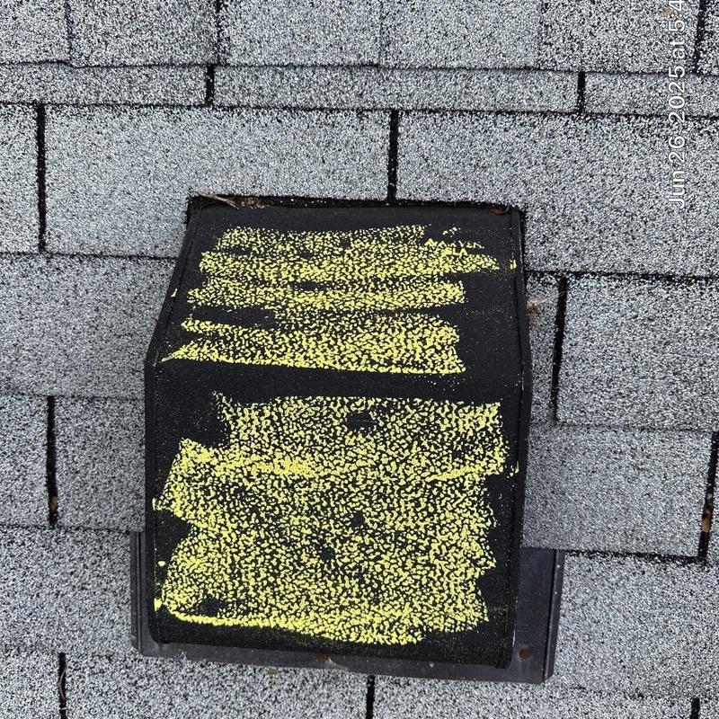 Roof vent with hail damage and granule loss on shingles