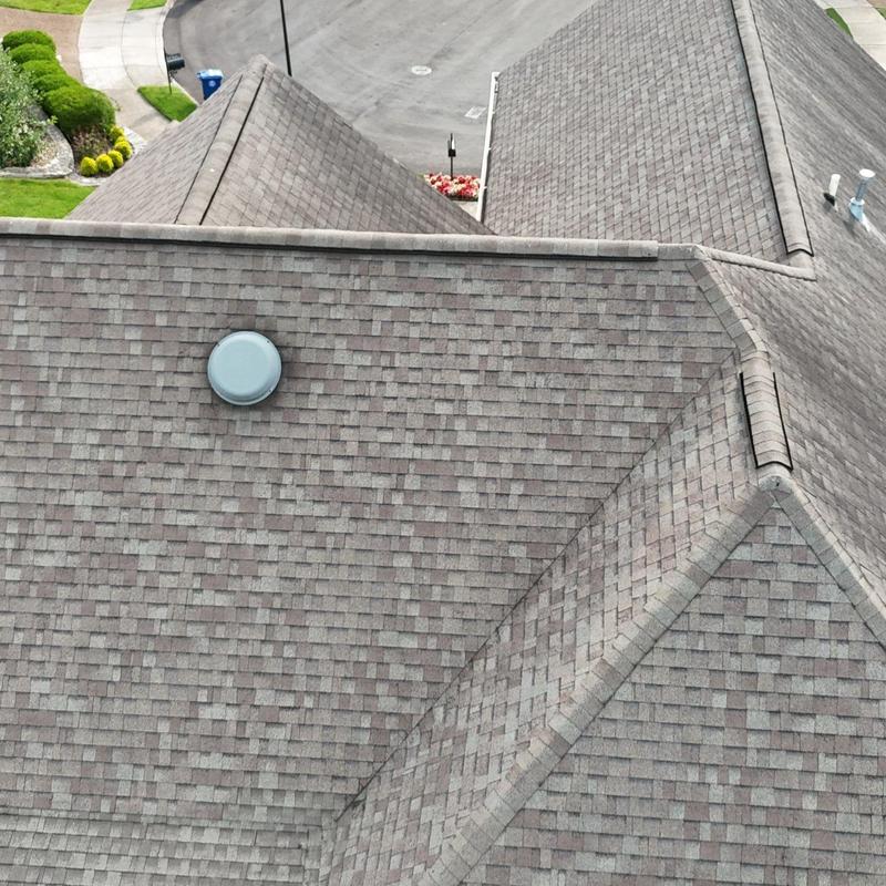 Roof shingles with ventilation cap and flashing inspection