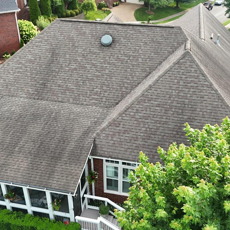 Asphalt shingle roof with hail damage and flashing issues