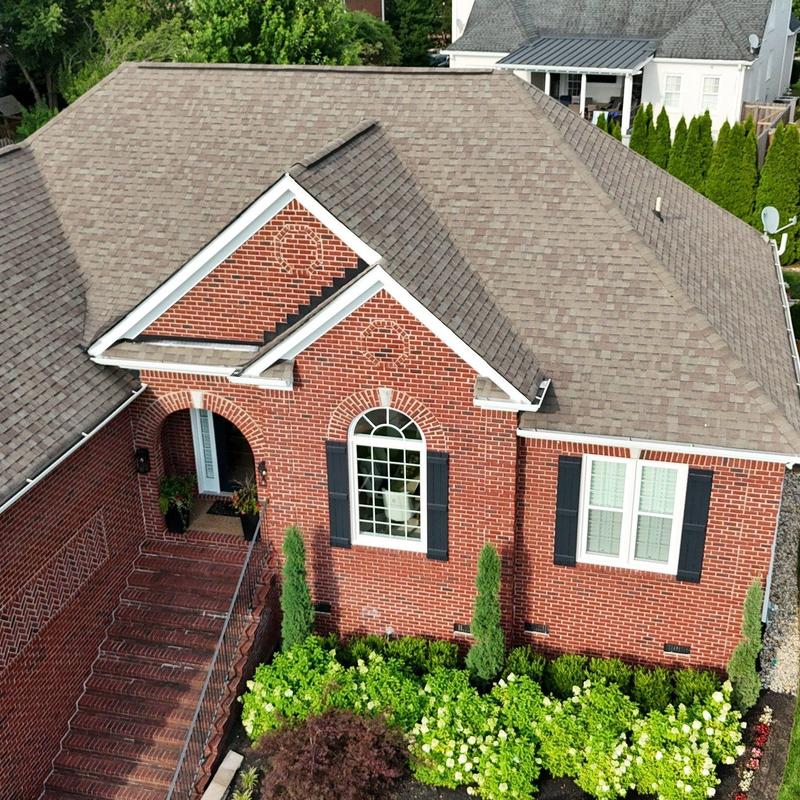 Asphalt shingle roof with mild hail damage visible