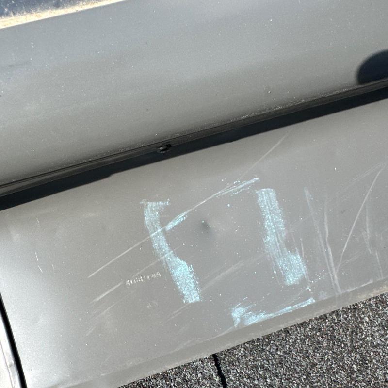 Metal roofing panel with dent and chalk markings