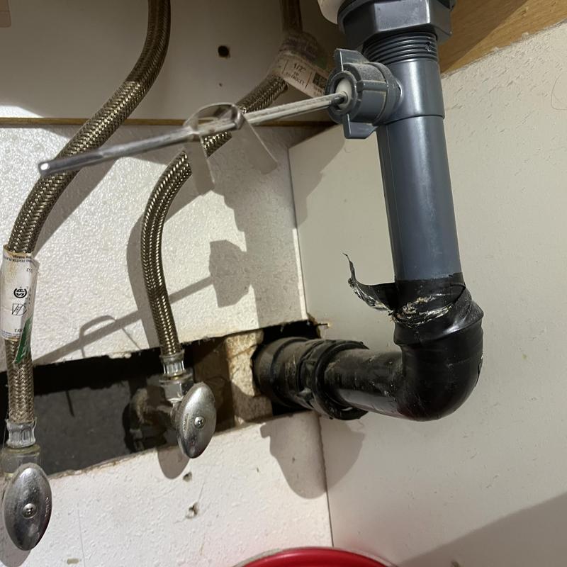 Kitchen sink drain line with trap removed and valve controls Kitchen sink drain line with trap removed and valve controls