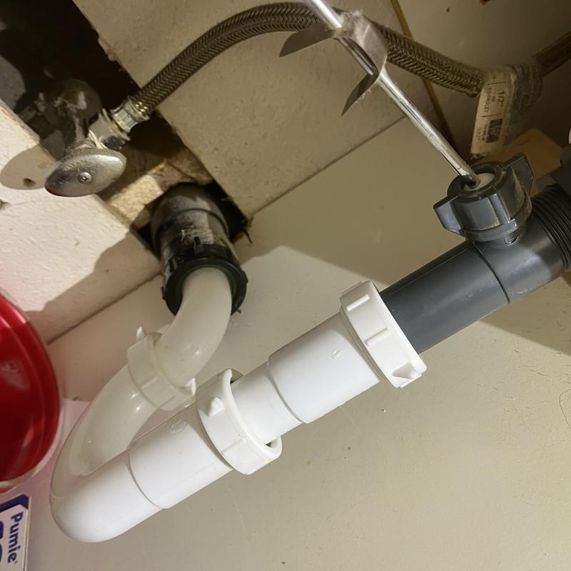 Kitchen sink drain trap and pipes inspection under sink Kitchen sink drain trap and pipes inspection under sink