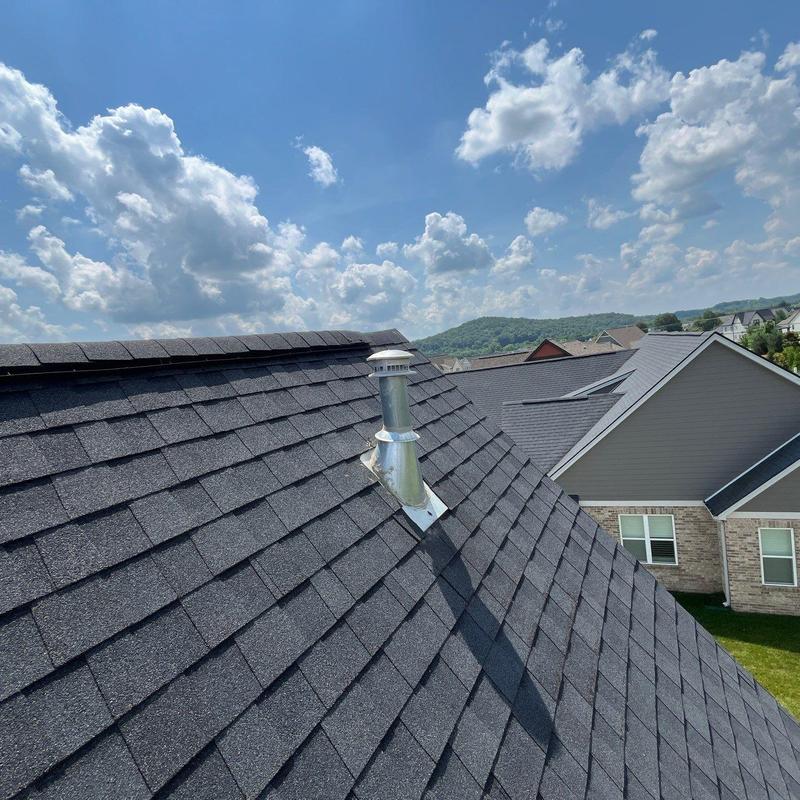 Roof shingles with impacted granule loss and ridge cap damage
