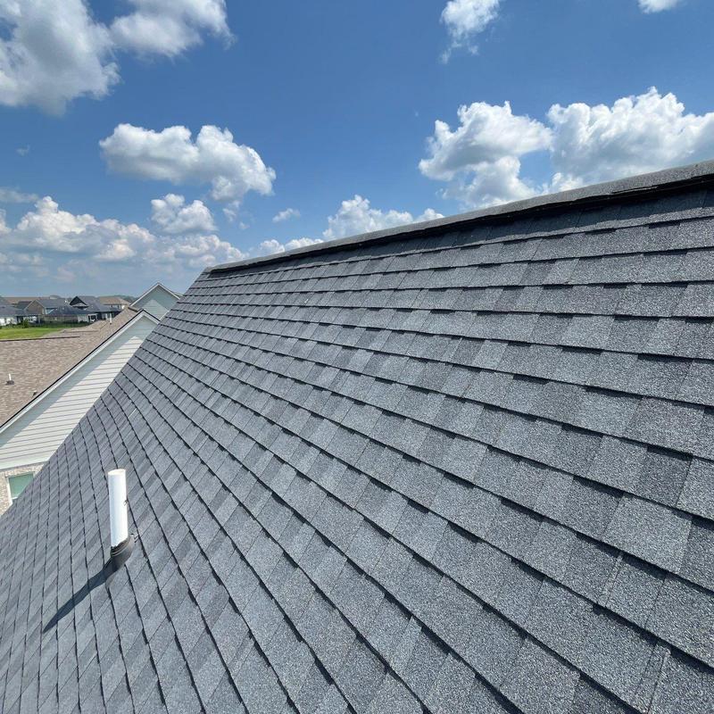 Roof shingles with hail damage and granule loss