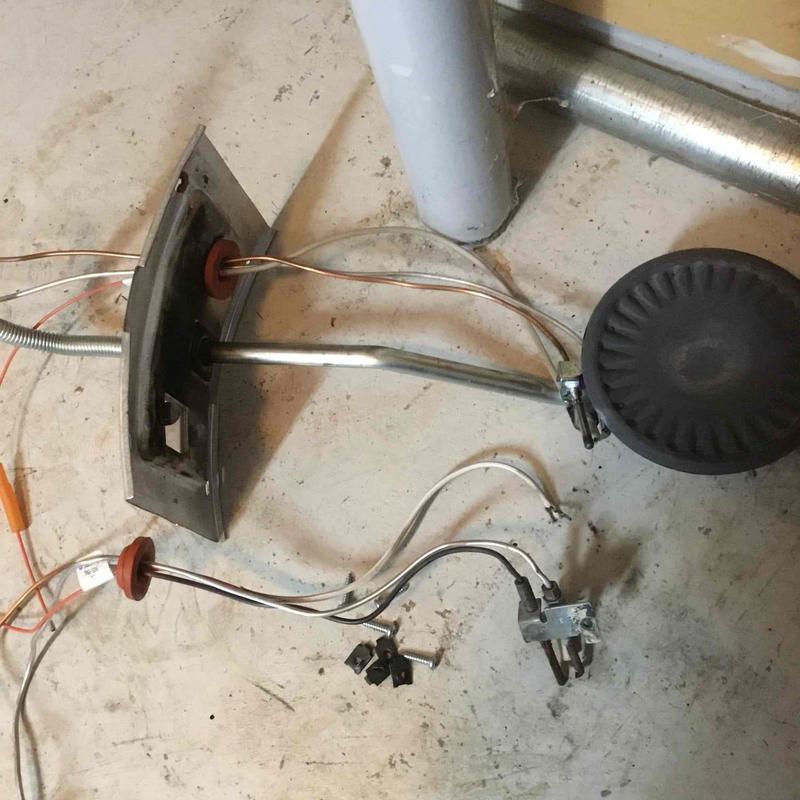Water heater burner assembly with damaged wiring and sparker Water heater burner assembly with damaged wiring and sparker