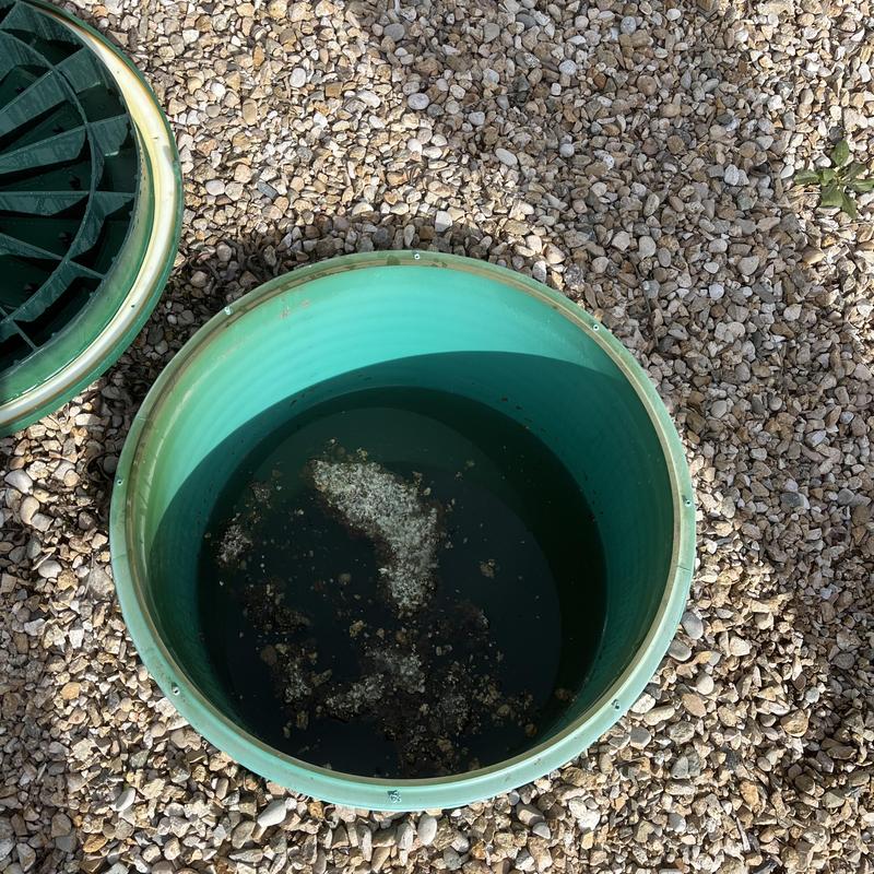 Septic tank partially pumped with debris inside Septic tank partially pumped with debris inside