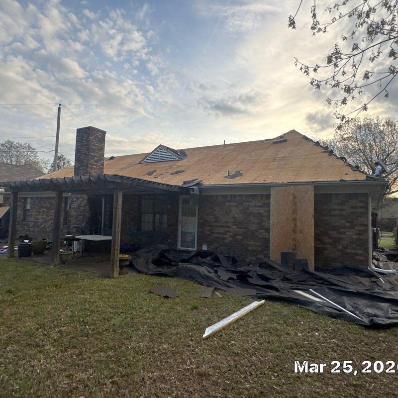 Roof decking exposed during storm damage repair in Cordova