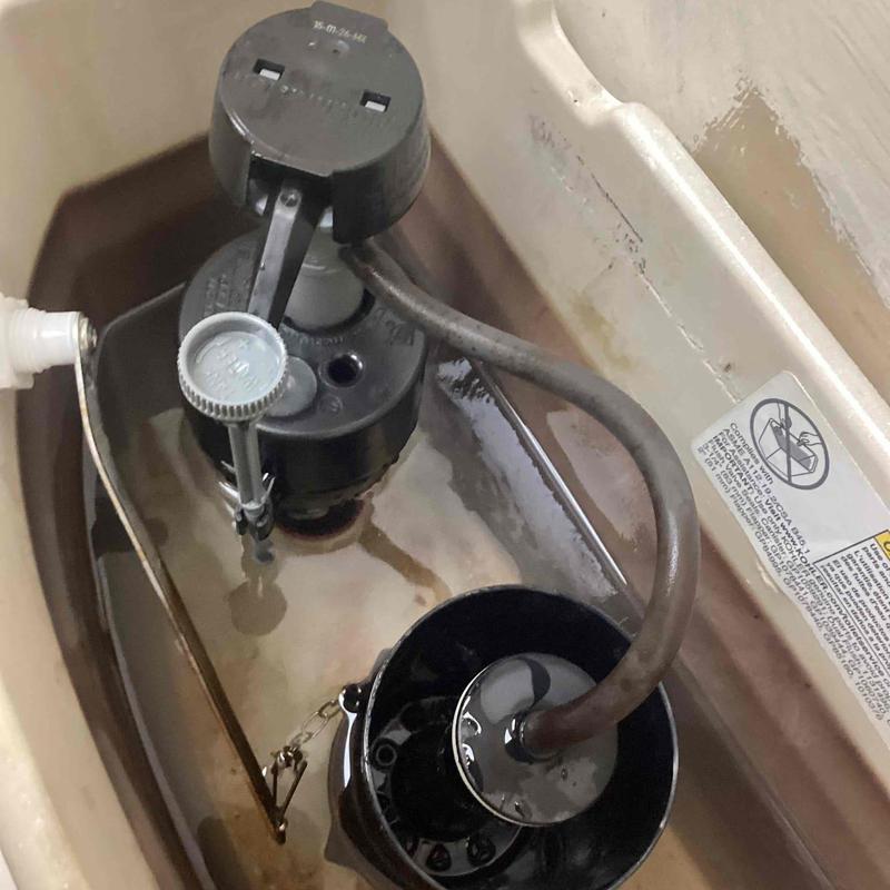 Toilet fill valve and flush valve in tank