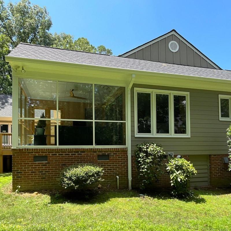 House exterior with new siding and screened porch