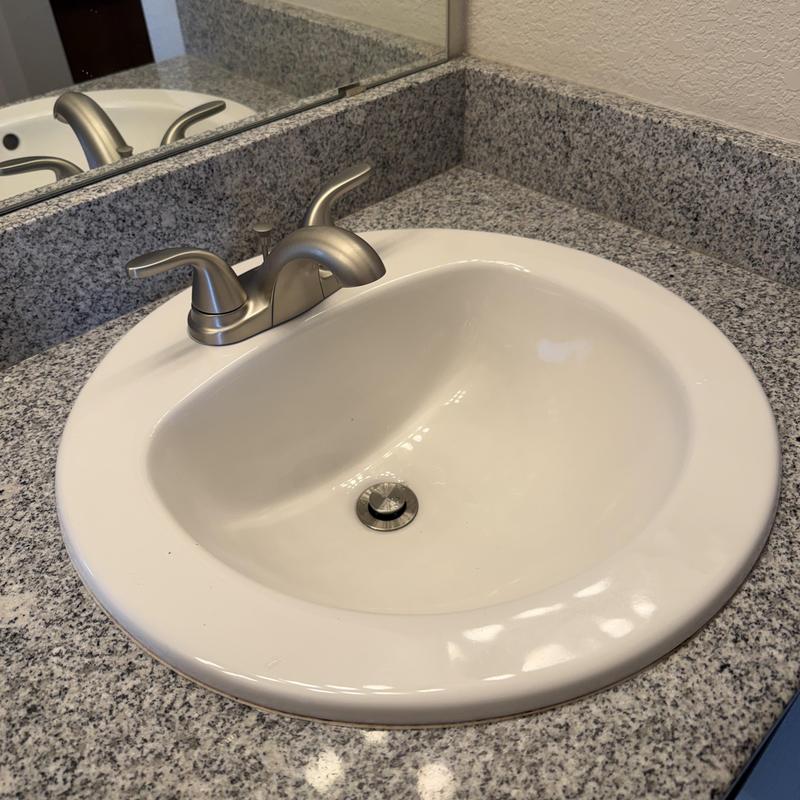Bathroom sink faucet with pop-up drain assembly