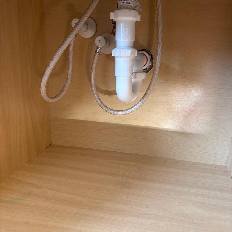 Bathroom faucet P-trap and pop-up assembly under sink