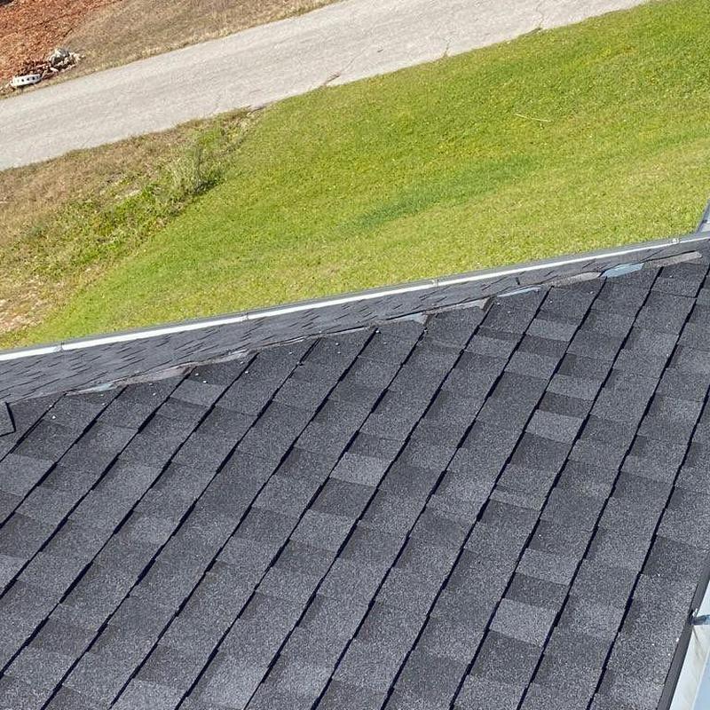 Hip cap shingles on shingle roof with new replacements
