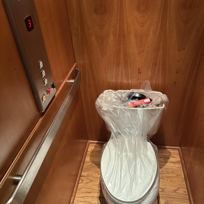 Toilet installation with protective plastic in elevator