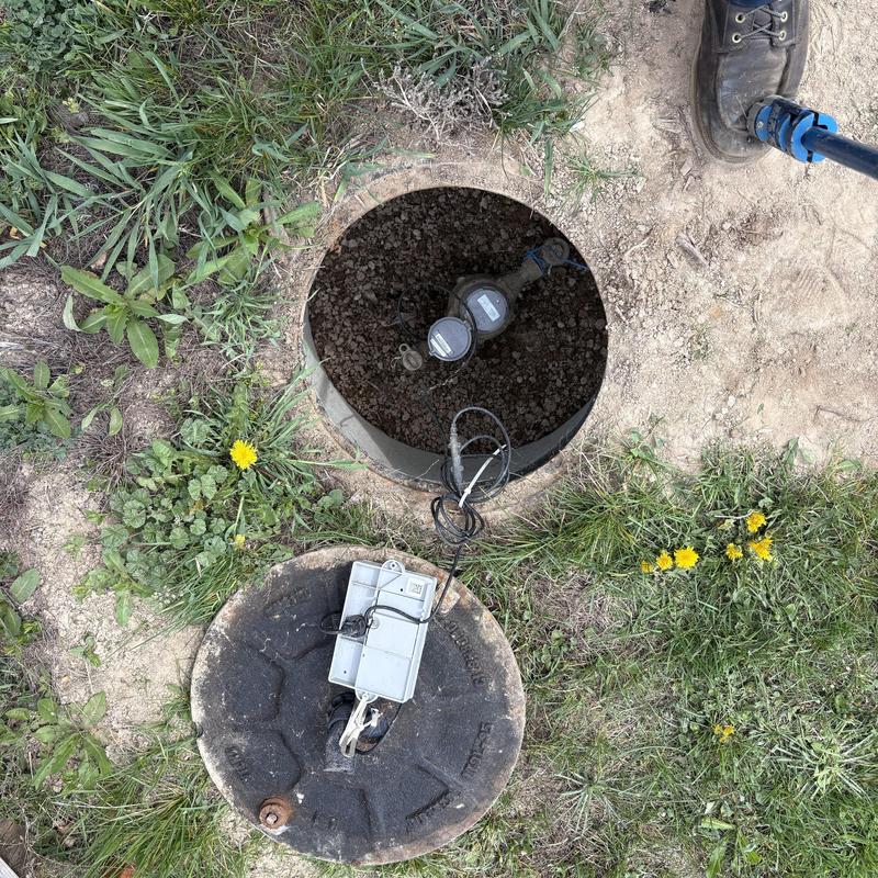 Water meter and service line with open valve box Water meter and service line with open valve box