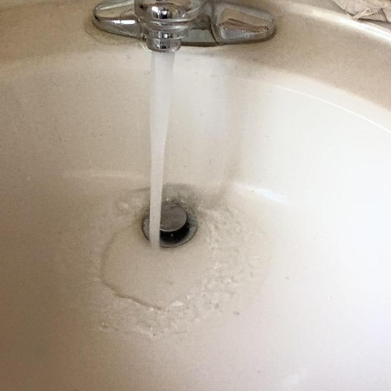 Bathroom sink drain with slow water flow
