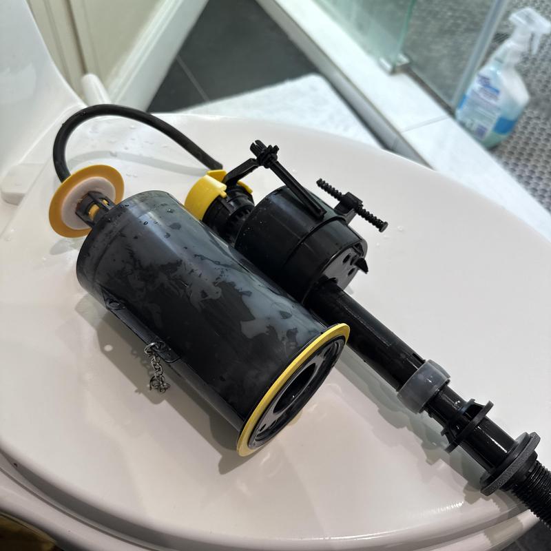 Toilet fill valve assembly on toilet lid