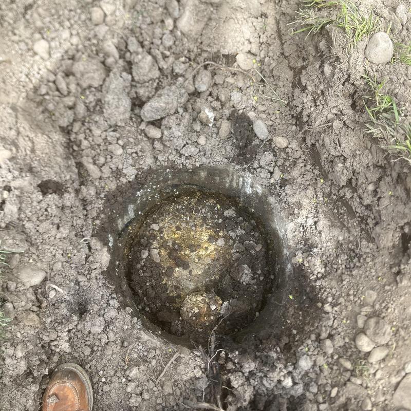 Septic tank cavity exposed for pump-out and abandonment
