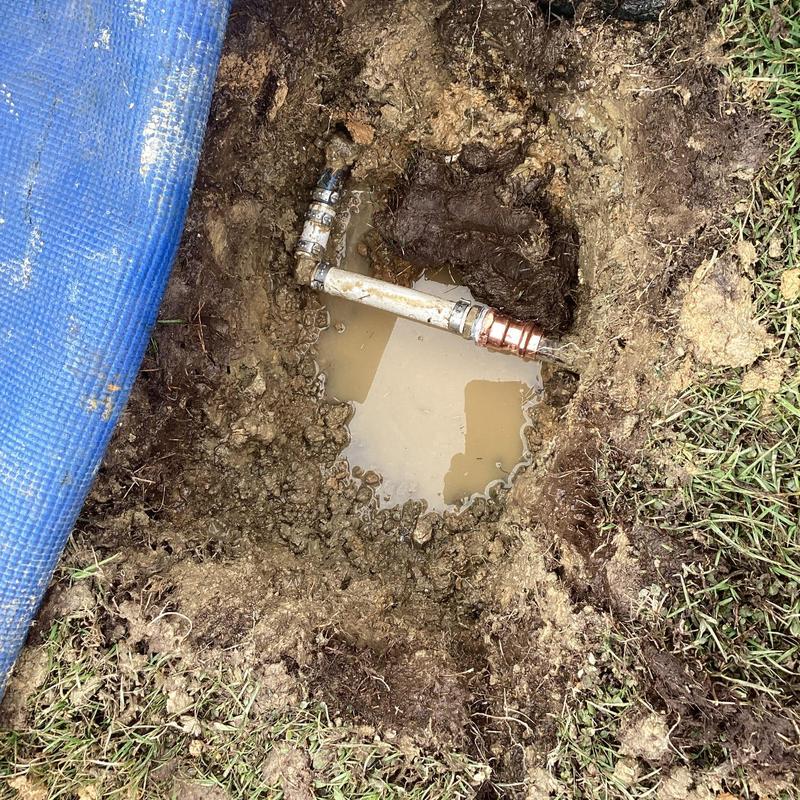 3/4 PVC water line with new fittings in muddy hole