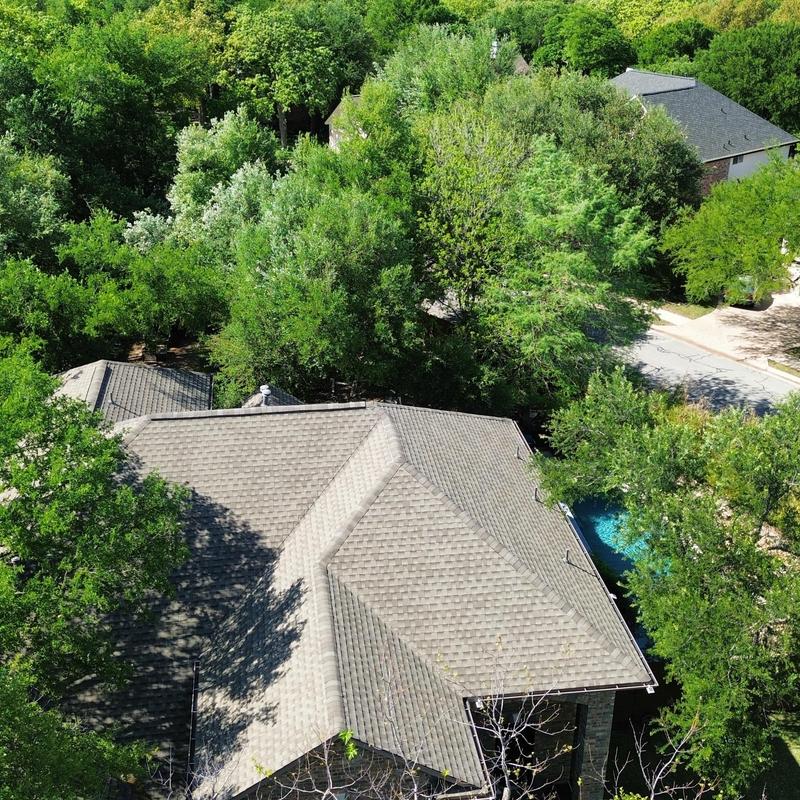 Roof with 30-year GAF Weatherwood shingles and gutters