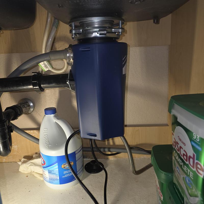 Garbage disposal unit under kitchen sink replaced