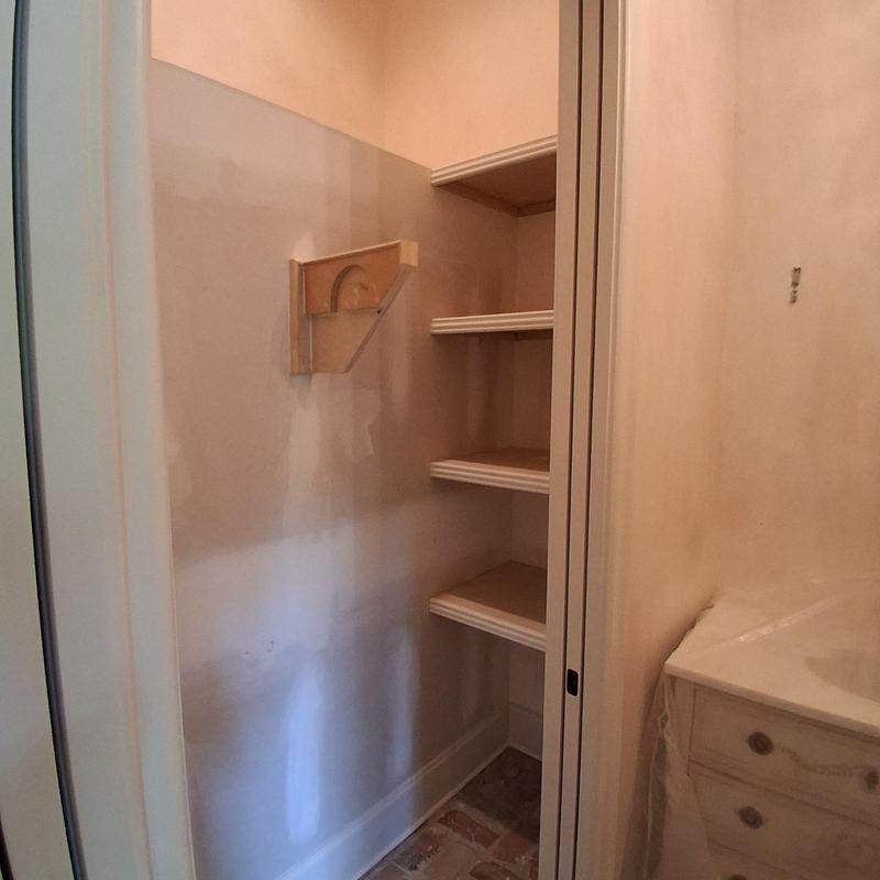 Custom built-in closet shelves with clothes rod and brackets