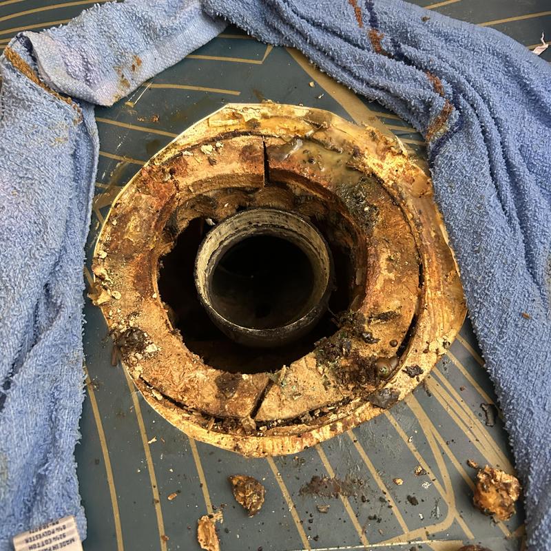 Toilet flange and copper drain line with corrosion and damage