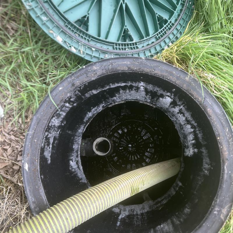 Septic tank open with hose for pump out service Septic tank open with hose for pump out service