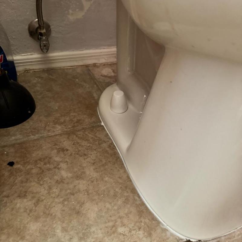 Toilet base with new flange bolt caps installation