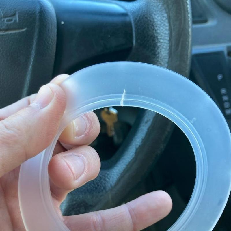 Toilet flush valve O-ring with crack close-up