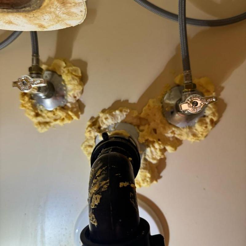 Laundry sink faucet angle stop valves with sealant foam