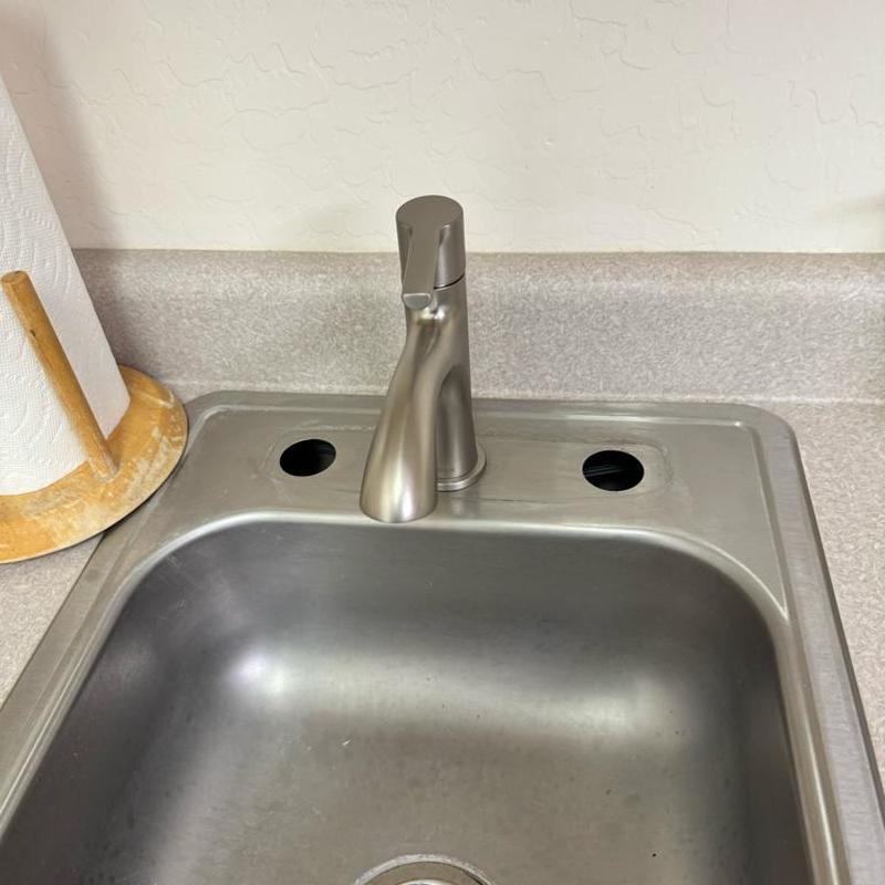 Kitchen sink faucet with two empty mounting holes