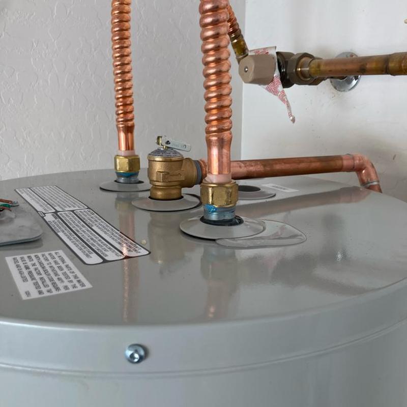 Electric water heater with copper piping and valve