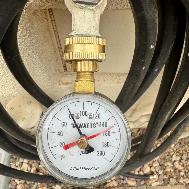 Pressure relief valve gauge installation near meter box