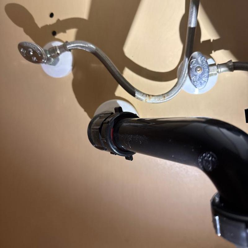 Black PVC drain pipe and angle stop valves installation