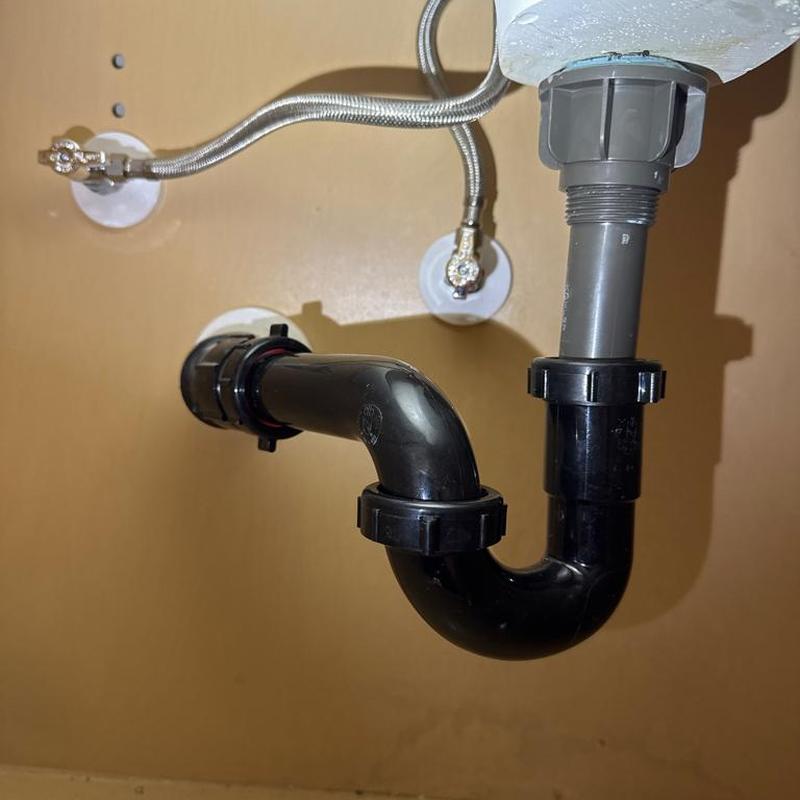 Bathroom sink drain trap and supply tubing installation