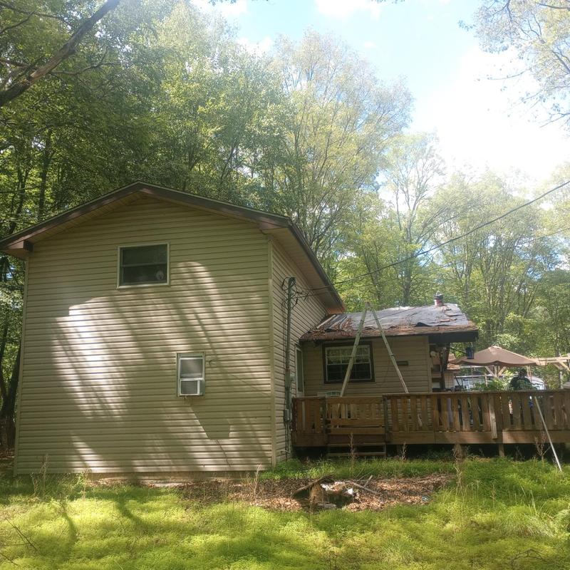 Roof shingles inspection on residential home exterior