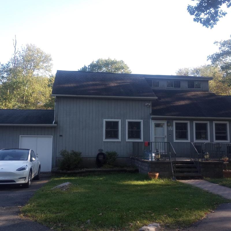 Roof shingles inspection and measurement on residential house