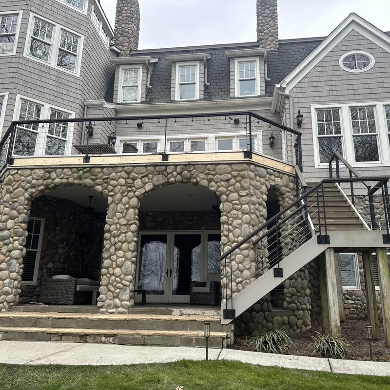 Stone chimney flashing and roof tie-in repair