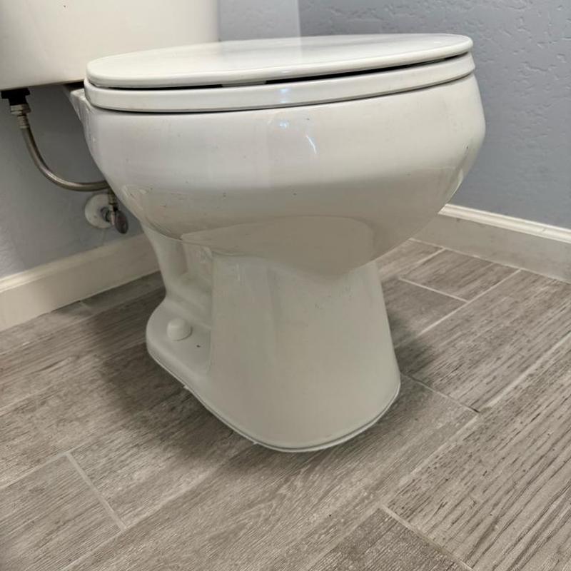 Toilet with replaced thick wax ring and fill valve
